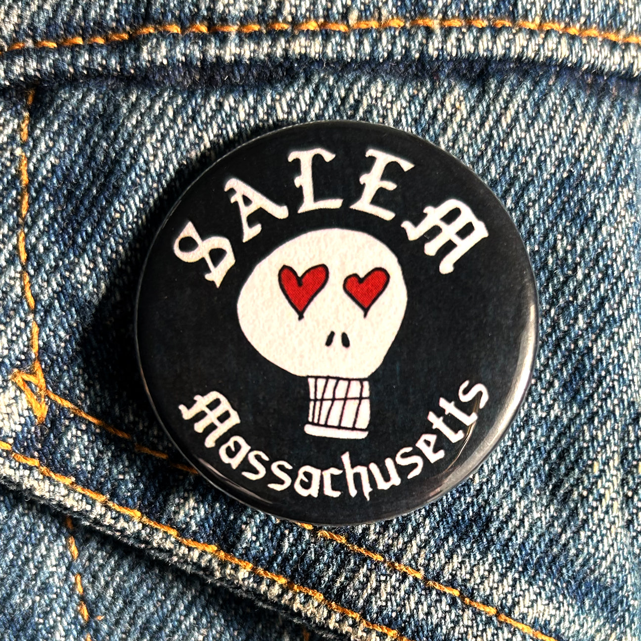 Salem heart eyes skull button
