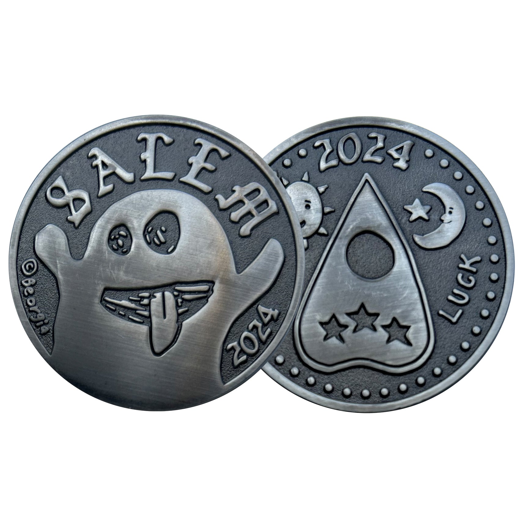 collectible coins one with ghost and other with Ouija Planchette. 