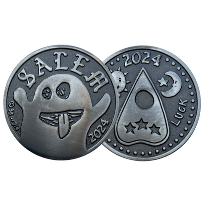 collectible coins one with ghost and other with Ouija Planchette. 